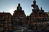 Ayutthaya, Thailand. Wat Chaiwatthanaram, the east rectangular platform of the old ubosot faces the river with  a couple of larger seated Buddhas. 